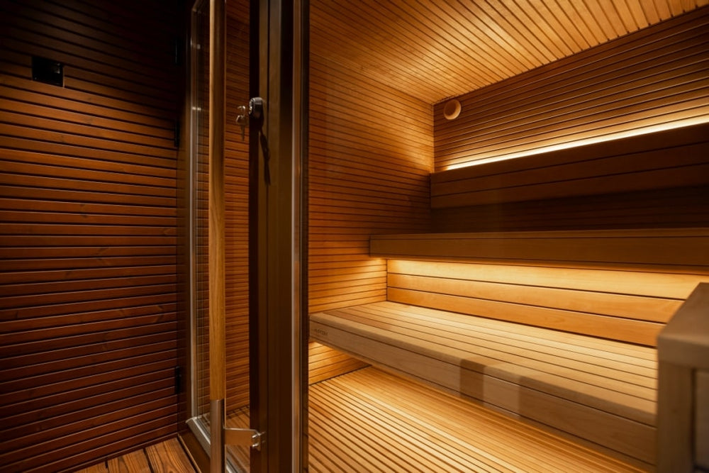 Sauna interior with tiered benches and under-bench lighting